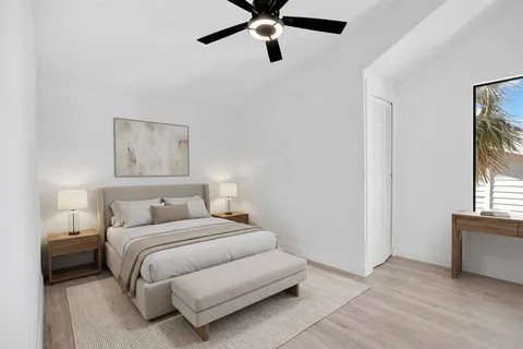 a bedroom with a bed and window
