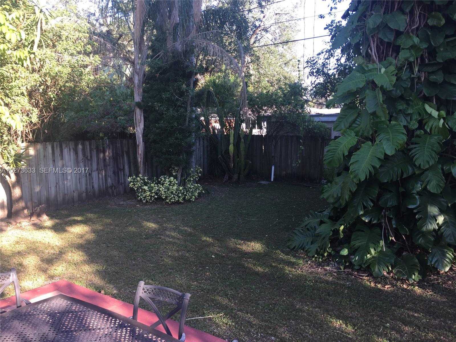 5886 Southwest 42nd Street Miami, FL 33155 - Photo 12 of 15 a backyard of a house with lots of green space