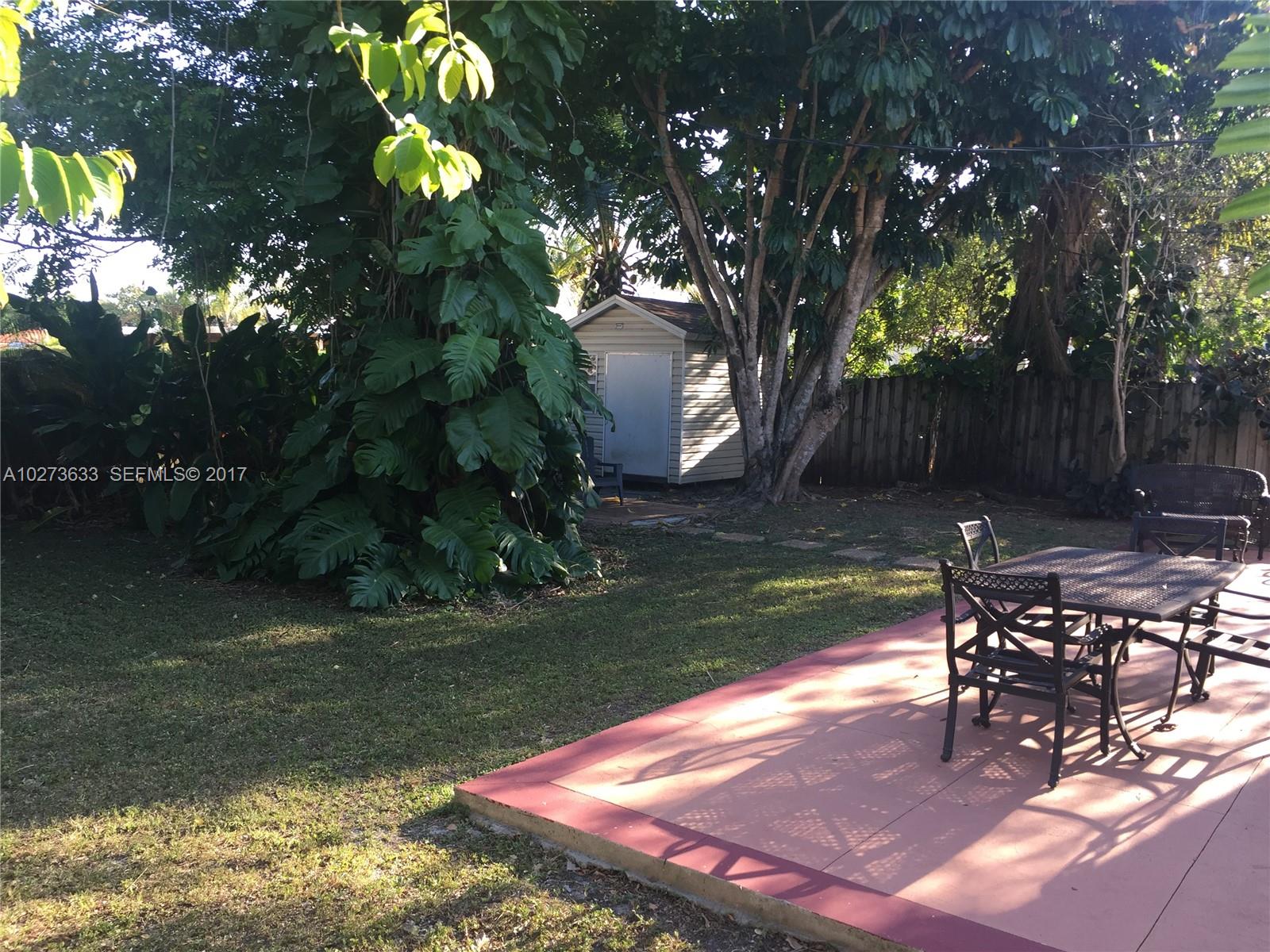 5886 Southwest 42nd Street Miami, FL 33155 - Photo 14 of 15 a view of a backyard with sitting area