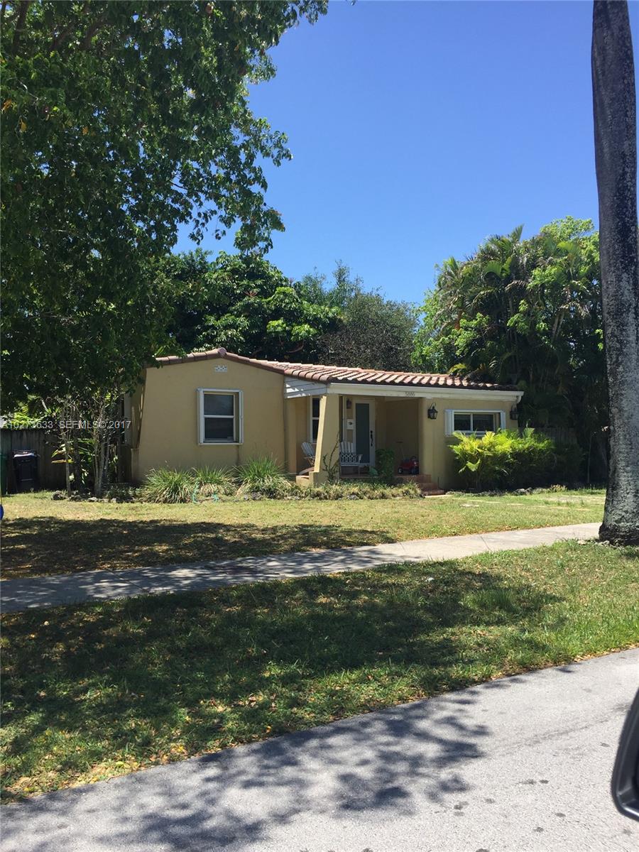 5886 Southwest 42nd Street Miami, FL 33155 - Photo 2 of 15 a front view of a house with a garden