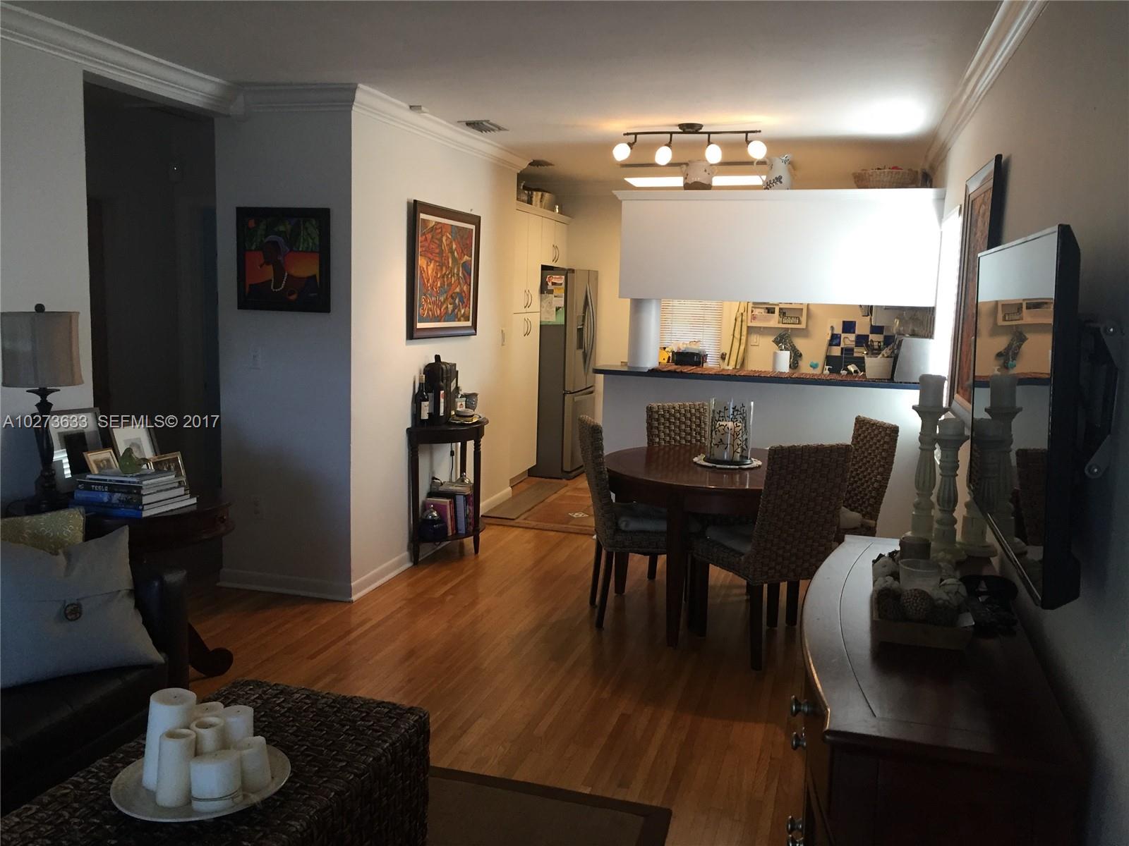 5886 Southwest 42nd Street Miami, FL 33155 - Photo 3 of 15 a living room with furniture and a flat screen tv