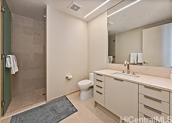 a bathroom with a toilet sink and shower