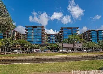 a front view of a building with a yard