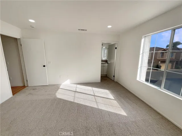 a view of hallway with stairs and furniture