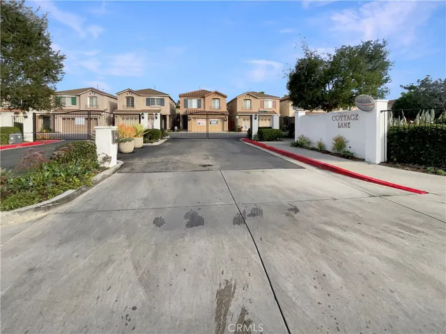 a view of multiple houses with a street