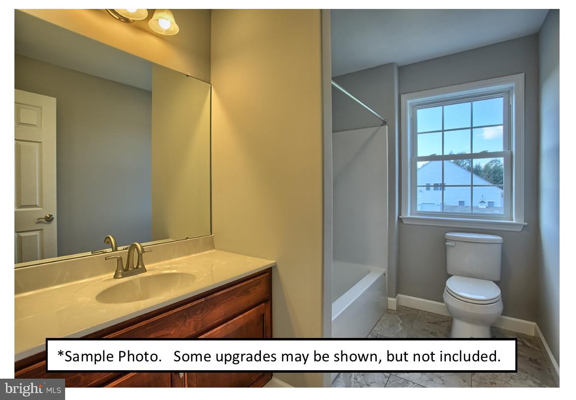 13 Castle Drive Robesonia, PA 19551 - Photo 22 of 22 a bathroom with a sink toilet and a mirror
