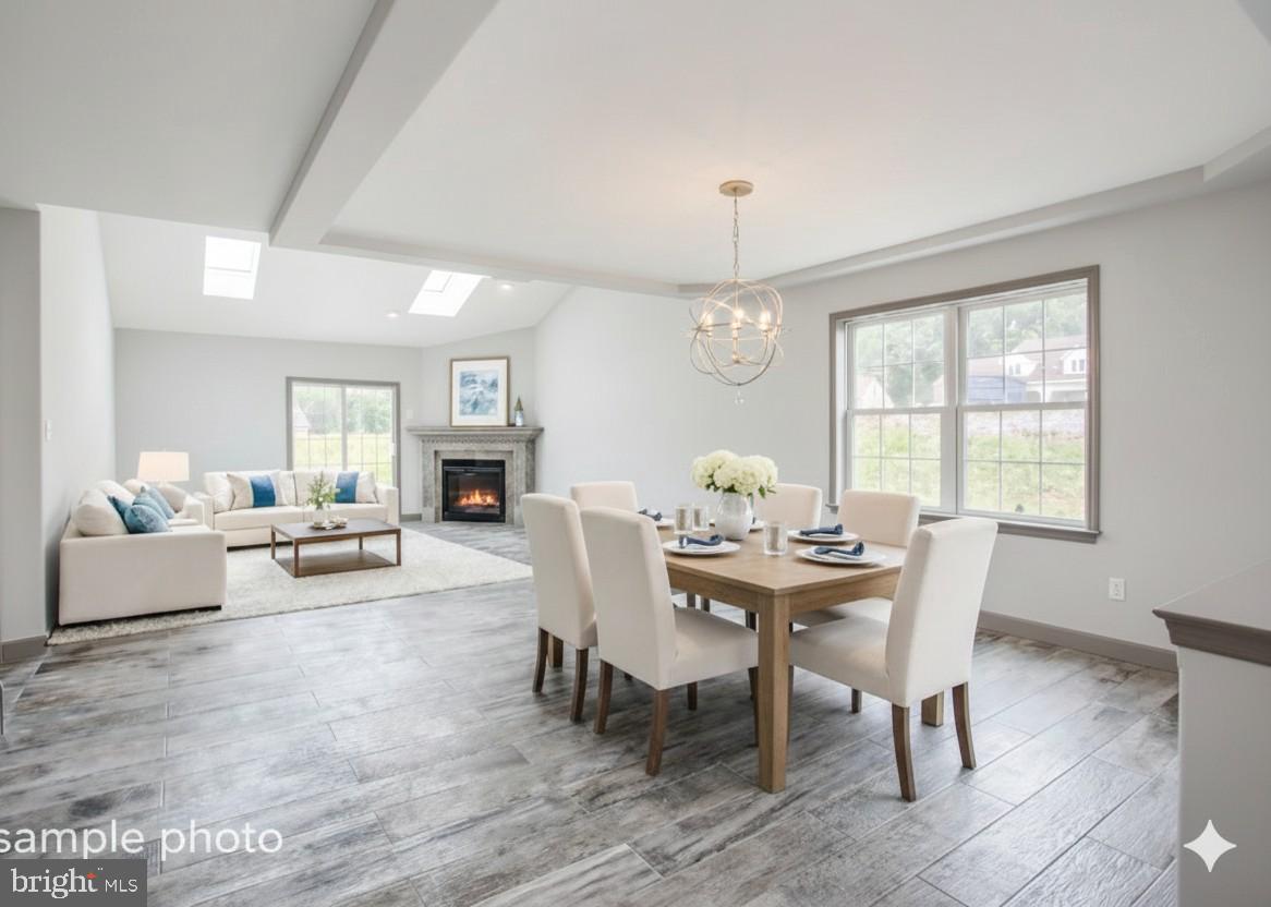 13 Castle Drive Robesonia, PA 19551 - Photo 4 of 22 a view of a dining room with furniture window and wooden floor