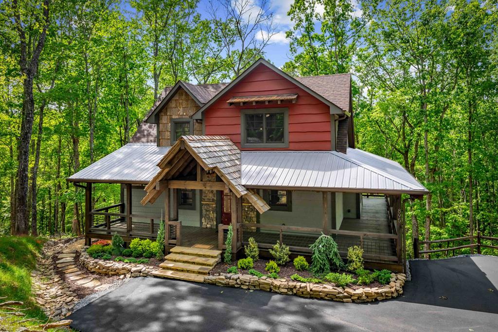 895 Price Road Blue Ridge, GA 30513 - Photo 111 of 140 a front view of a house with garden
