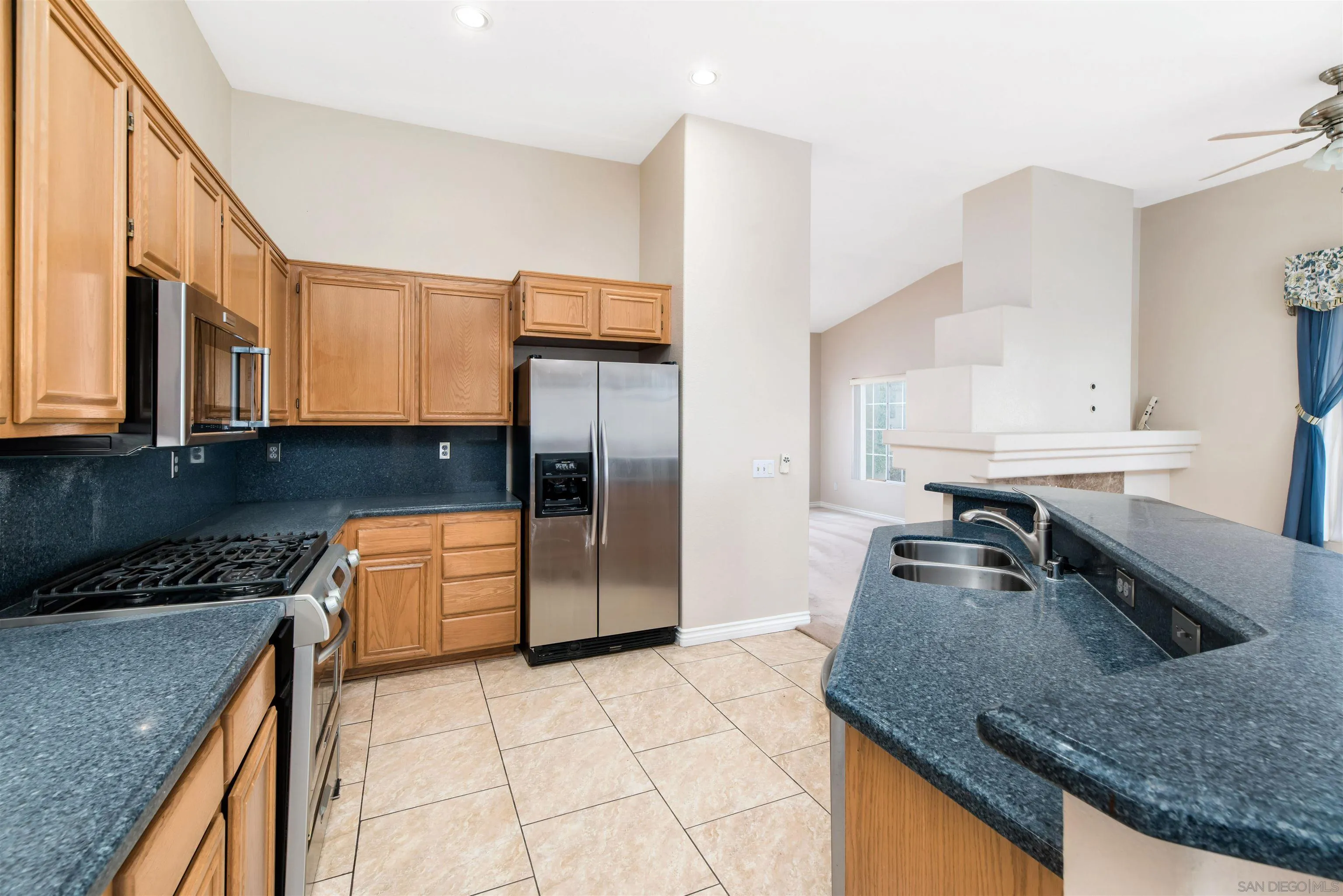 2002 Snapdragon Lane Alpine, CA 91901 - Photo 7 of 25 a kitchen with stainless steel appliances granite countertop a sink a stove and a refrigerator
