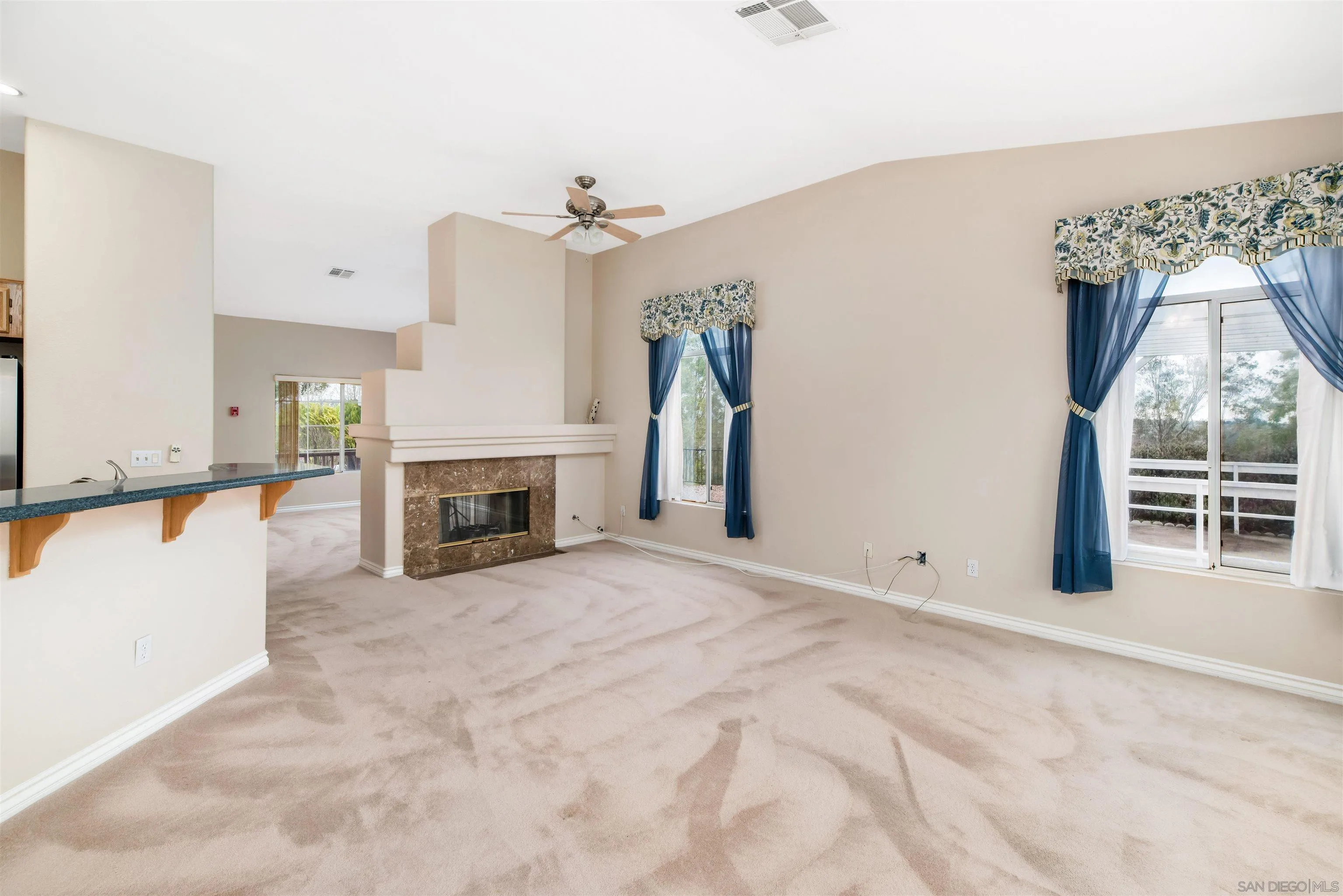 2002 Snapdragon Lane Alpine, CA 91901 - Photo 10 of 25 an empty room with windows and fireplace