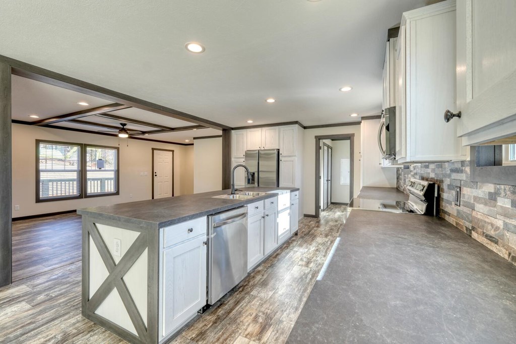 2045 Upper Bell Creek Road Hiawassee, GA 30546 - Photo 17 of 47 a large kitchen with stainless steel appliances granite countertop a large counter top and a wooden floors