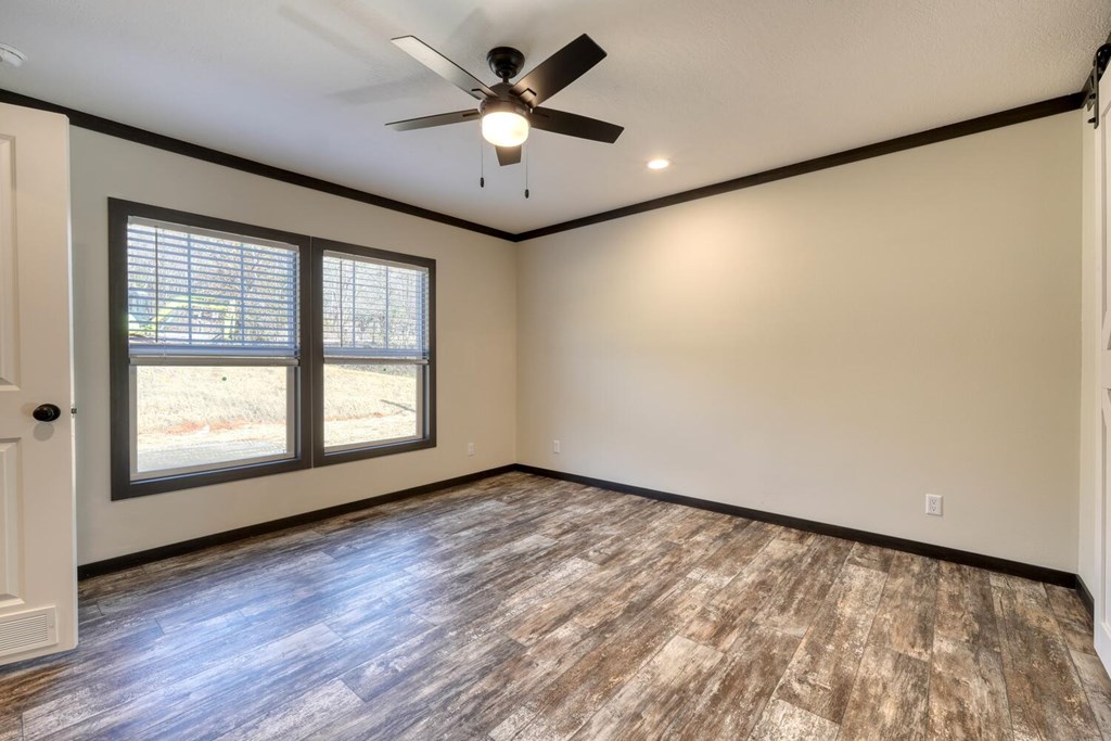 2045 Upper Bell Creek Road Hiawassee, GA 30546 - Photo 23 of 47 an empty room with wooden floor and windows
