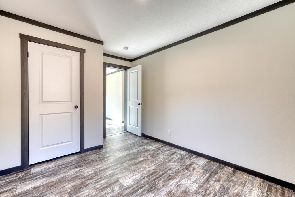 2045 Upper Bell Creek Road Hiawassee, GA 30546 - Photo 30 of 47 a view of an empty room with wooden floor and closet