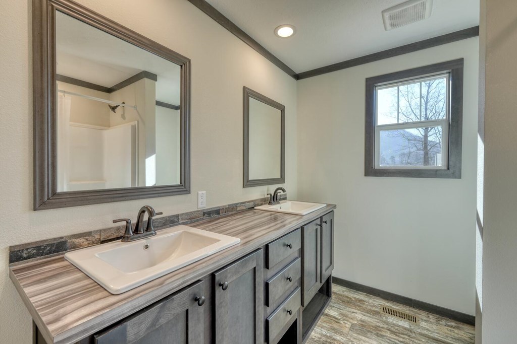 2045 Upper Bell Creek Road Hiawassee, GA 30546 - Photo 31 of 47 a bathroom with a sink vanity and a mirror