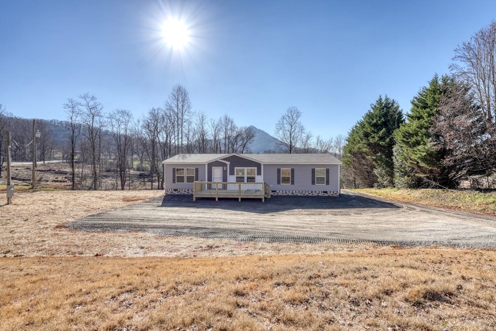 2045 Upper Bell Creek Road Hiawassee, GA 30546 - Photo 41 of 47 a front view of a house with a yard covered in snow