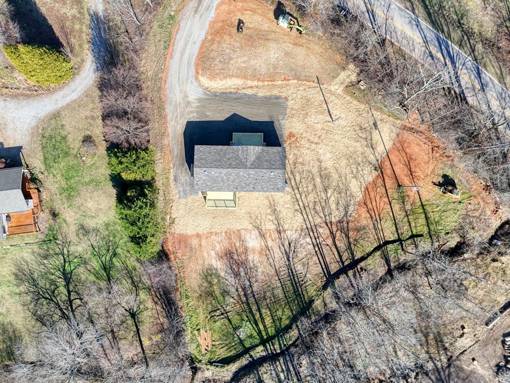 2045 Upper Bell Creek Road Hiawassee, GA 30546 - Photo 42 of 47 a picture of a tree in front of a house