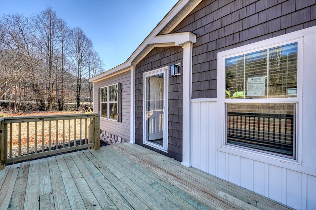 2045 Upper Bell Creek Road Hiawassee, GA 30546 - Photo 9 of 47 a view of a house with a deck