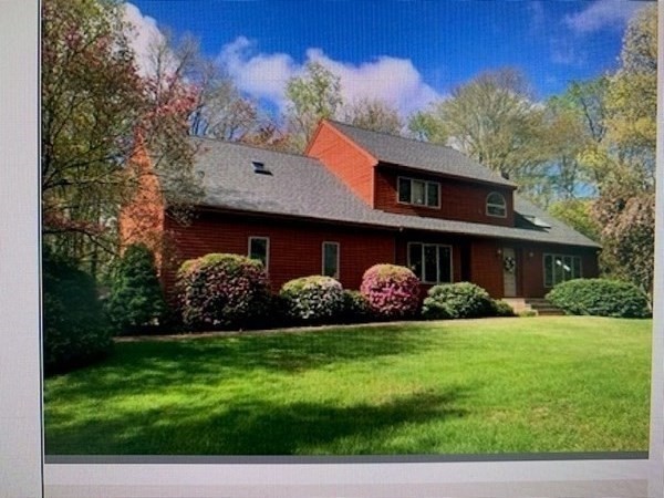 a view of a house with a yard