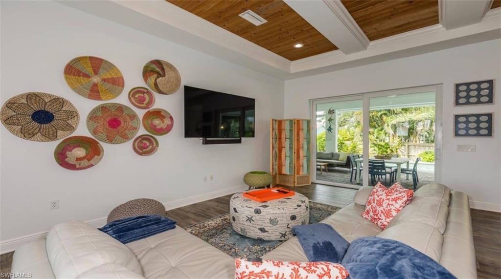118 Bermuda Road Marco Island, FL 34145 - Photo 5 of 16 a living room with furniture and a flat screen tv