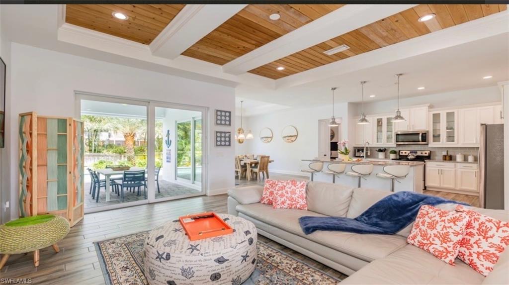 118 Bermuda Road Marco Island, FL 34145 - Photo 8 of 16 a living room with furniture and wooden floor