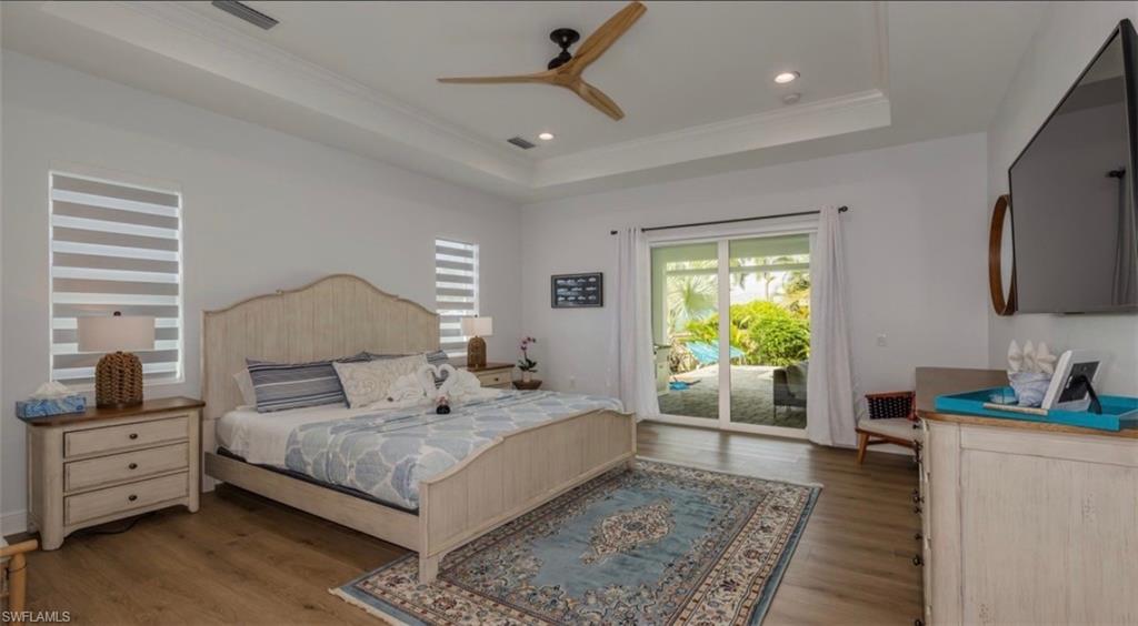 118 Bermuda Road Marco Island, FL 34145 - Photo 9 of 16 a bedroom with a large bed and a window