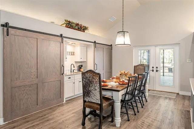 a dining room with furniture and window