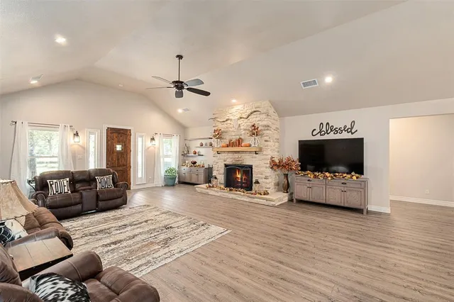 a living room with furniture fireplace and flat screen tv