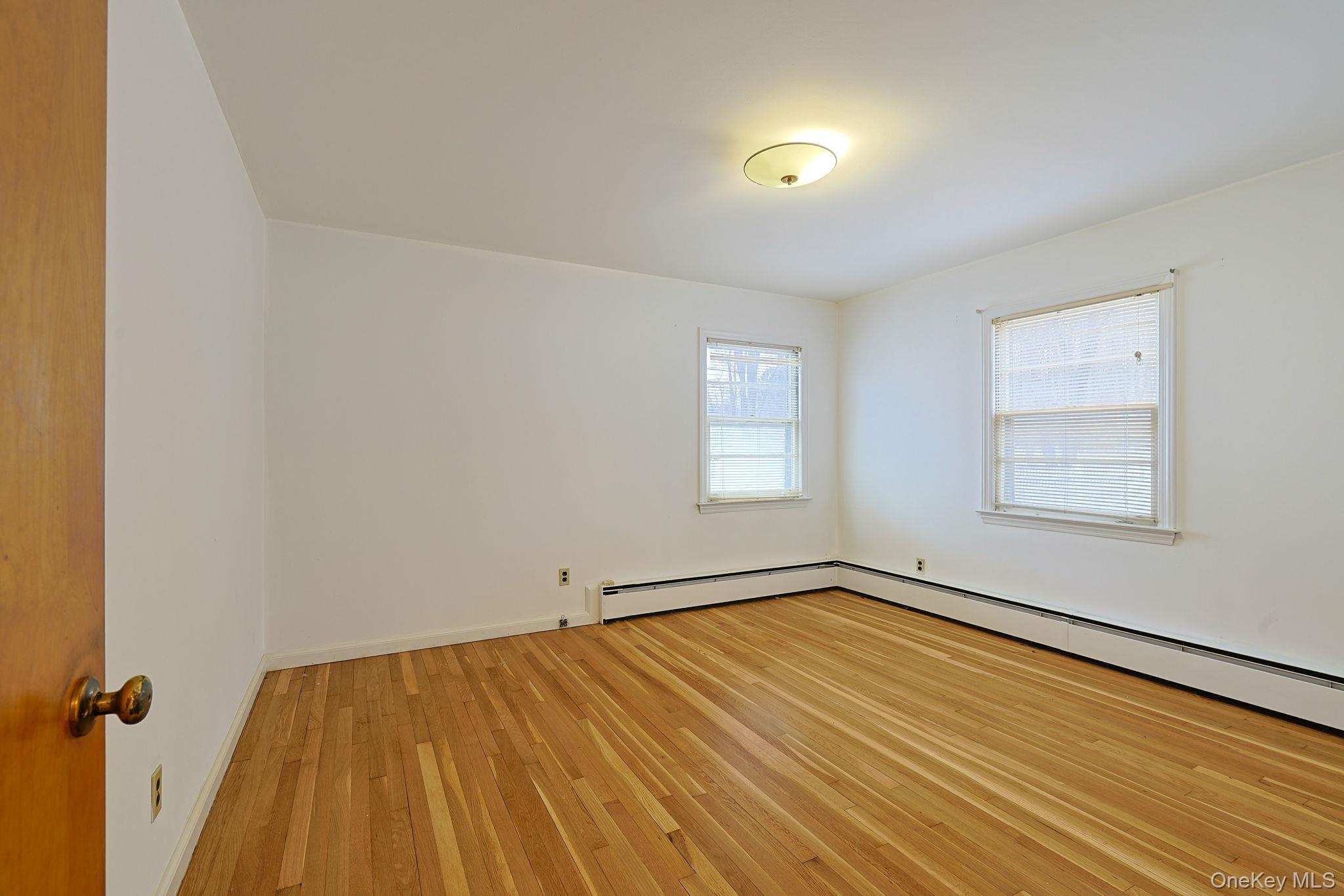 34 Old Bedford Road Goldens Bridge, NY 10526 - Photo 13 of 38 an empty room with a hardwood and windows