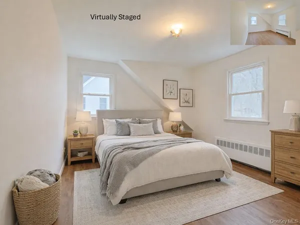 a bedroom with a bed and a lamp