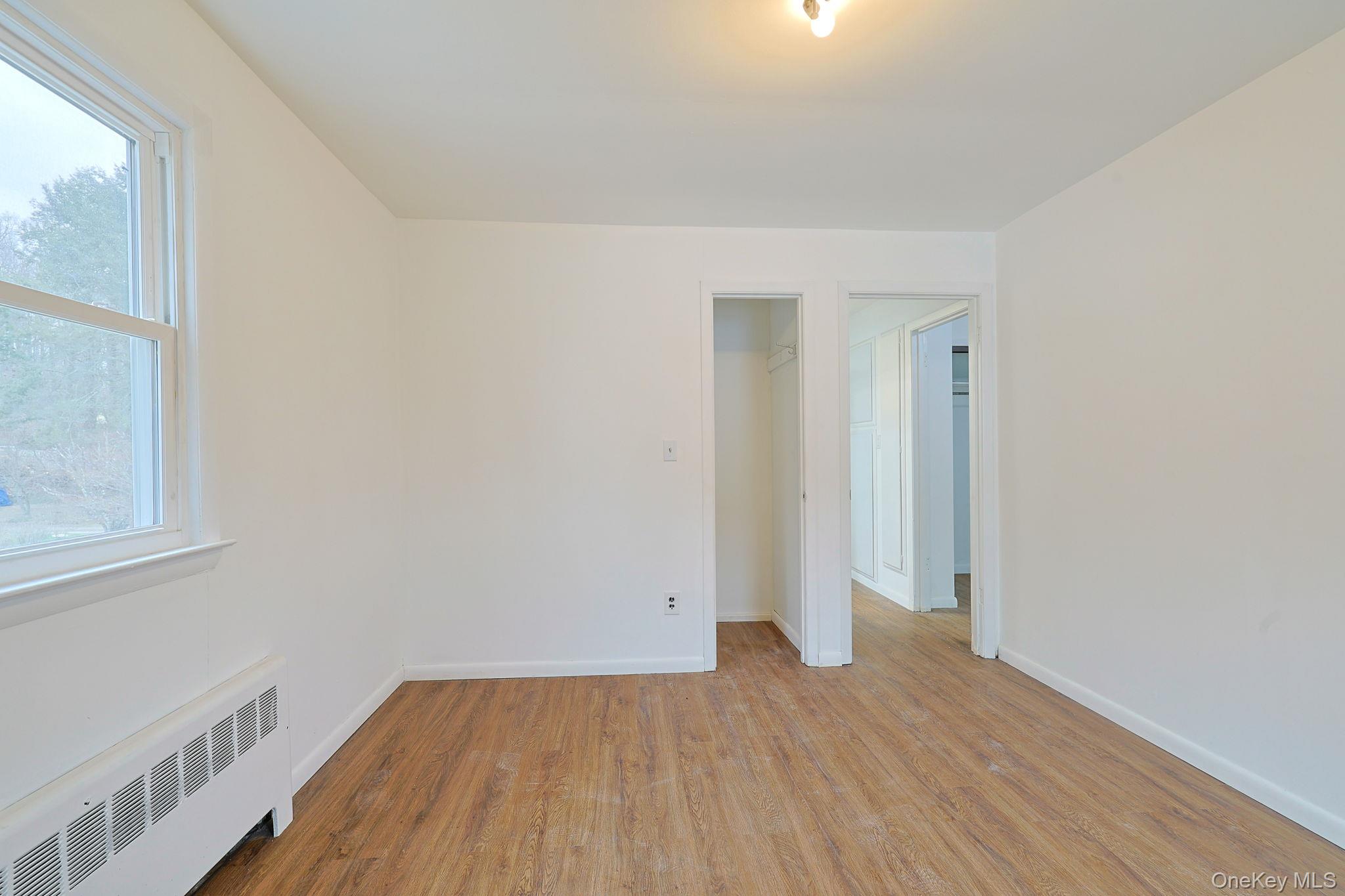 34 Old Bedford Road Goldens Bridge, NY 10526 - Photo 20 of 38 an empty room with wooden floor and windows
