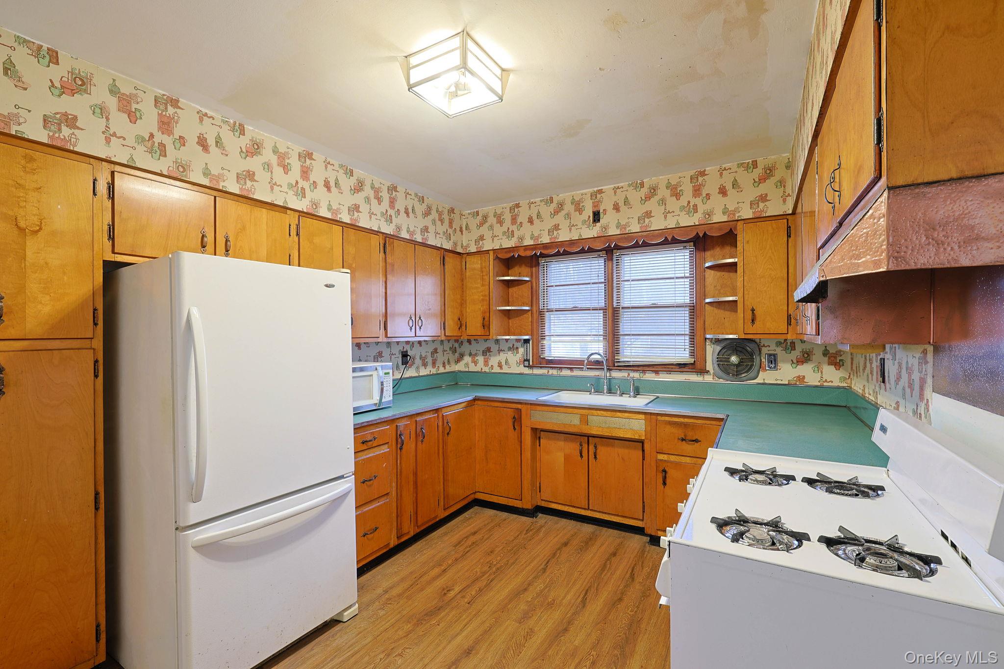 34 Old Bedford Road Goldens Bridge, NY 10526 - Photo 3 of 38 a kitchen with stainless steel appliances granite countertop a refrigerator and a sink
