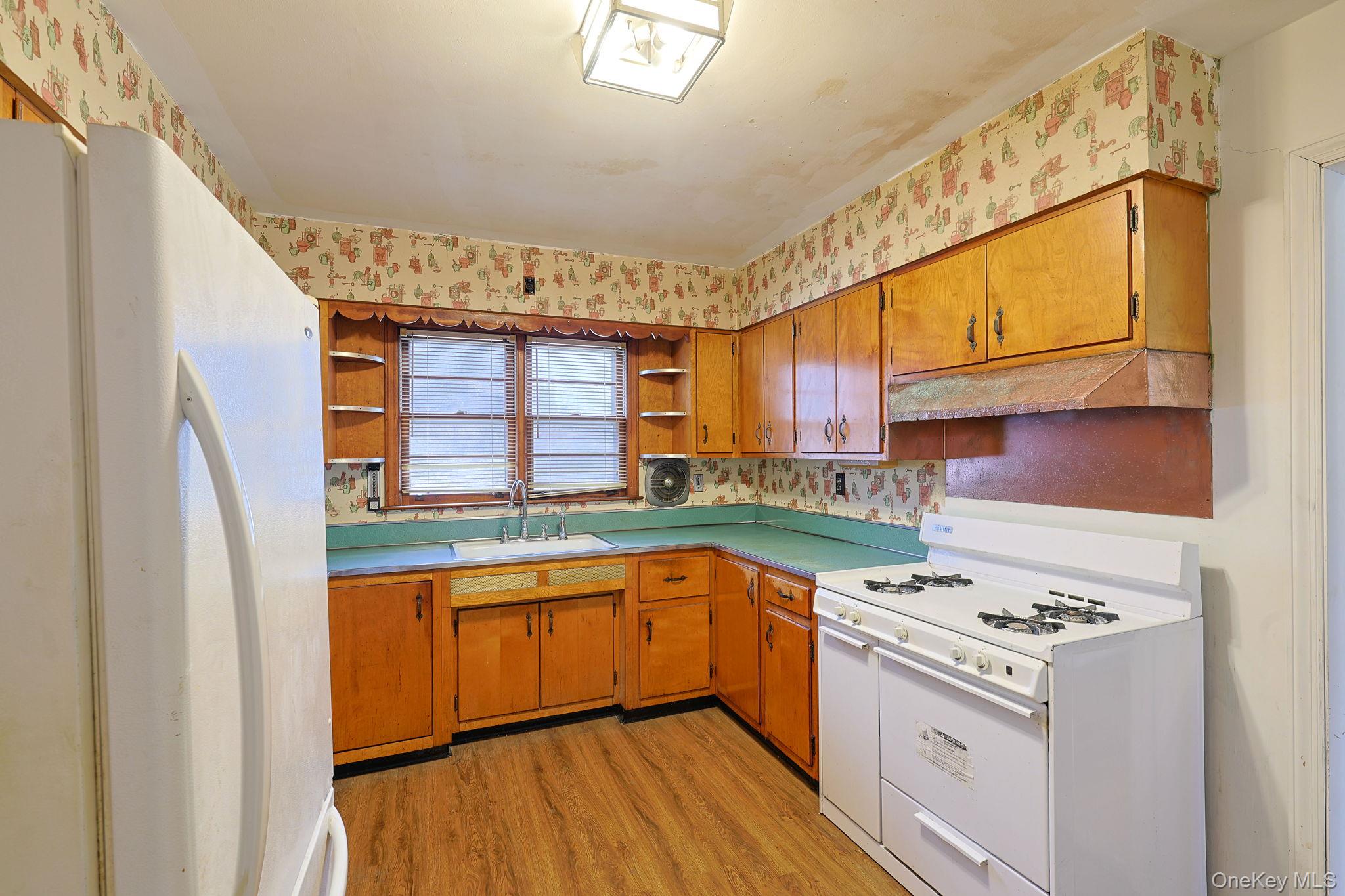 34 Old Bedford Road Goldens Bridge, NY 10526 - Photo 4 of 38 a kitchen with a stove a sink and a refrigerator