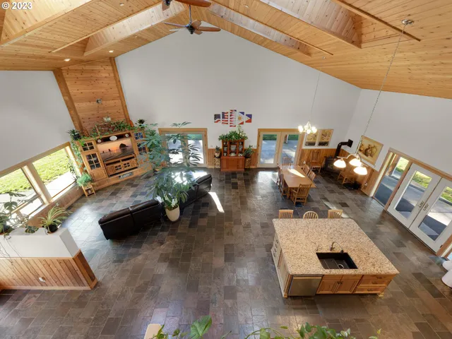 a table with chairs and a wooden floor