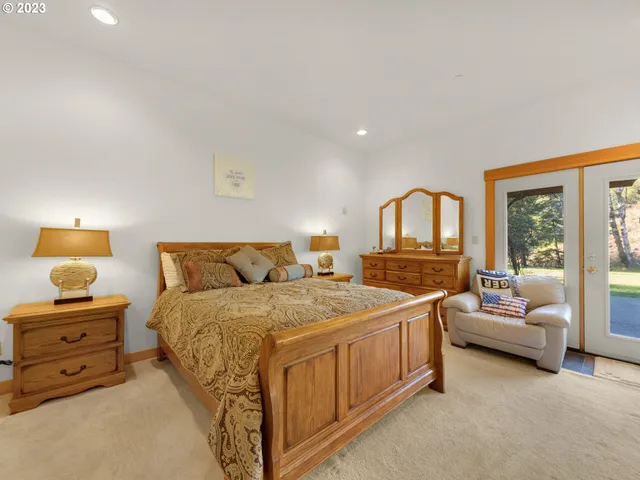 a bedroom with double bed and a window