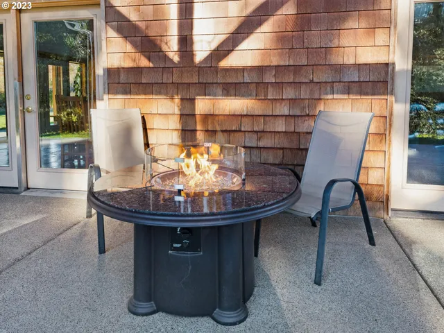 a view of a dining room with furniture and window