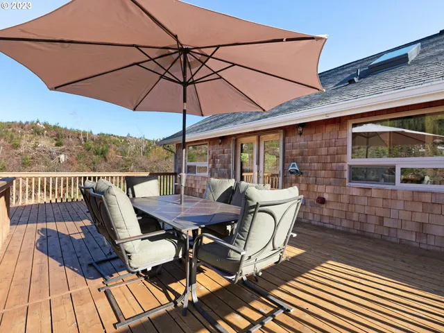 a balcony view with a seating space