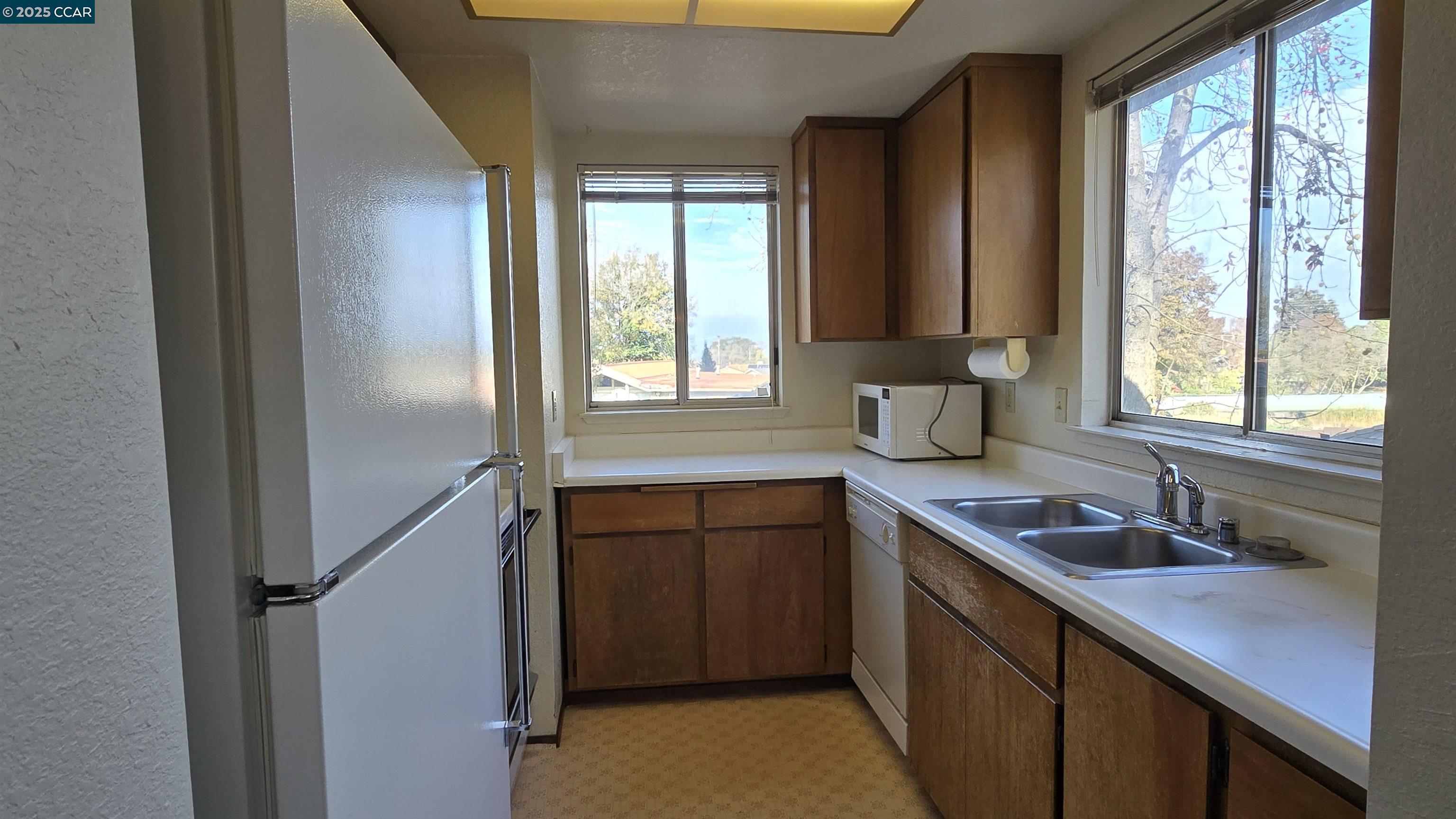 1123 Chadwick Circle Bay Point, CA 94565 - Photo 8 of 22 a kitchen with a sink and large window