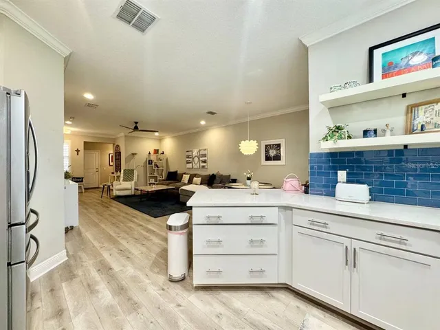 a kitchen with a sink stainless steel appliances and cabinets
