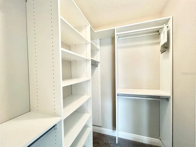 a view of an empty walk in closet