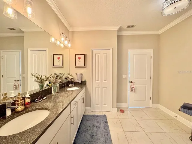 a spacious bathroom with a sink double vanity