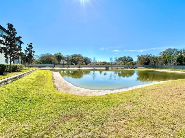a view of a swimming pool and lake