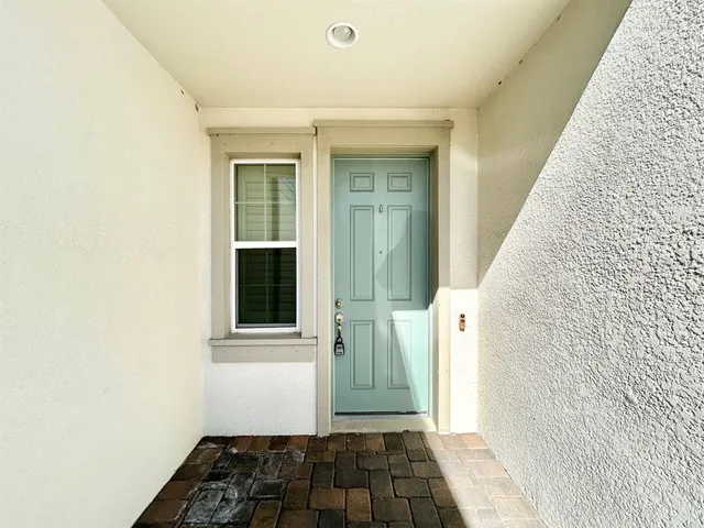 a view of a door and a window