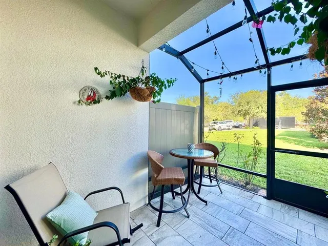 a view of a chairs and table in a patio