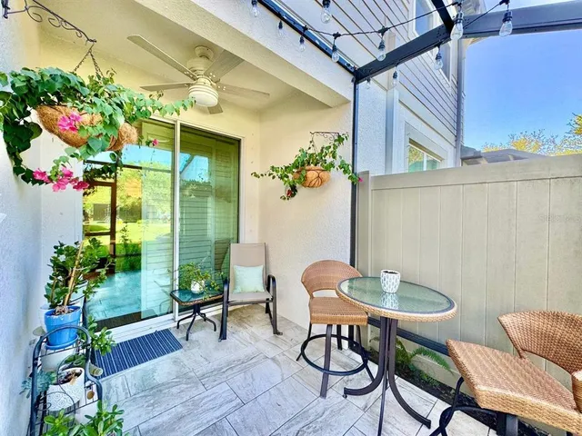 a outdoor living space with furniture and a potted plant