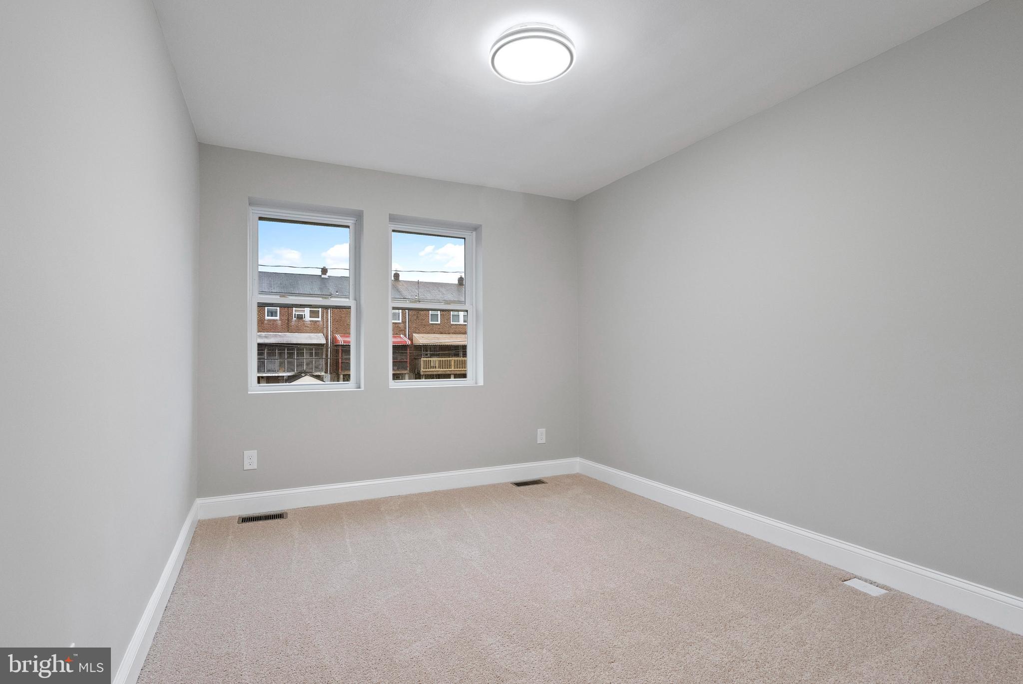 1641 Northwick Road Baltimore, MD 21218 - Photo 11 of 24 an empty room with windows