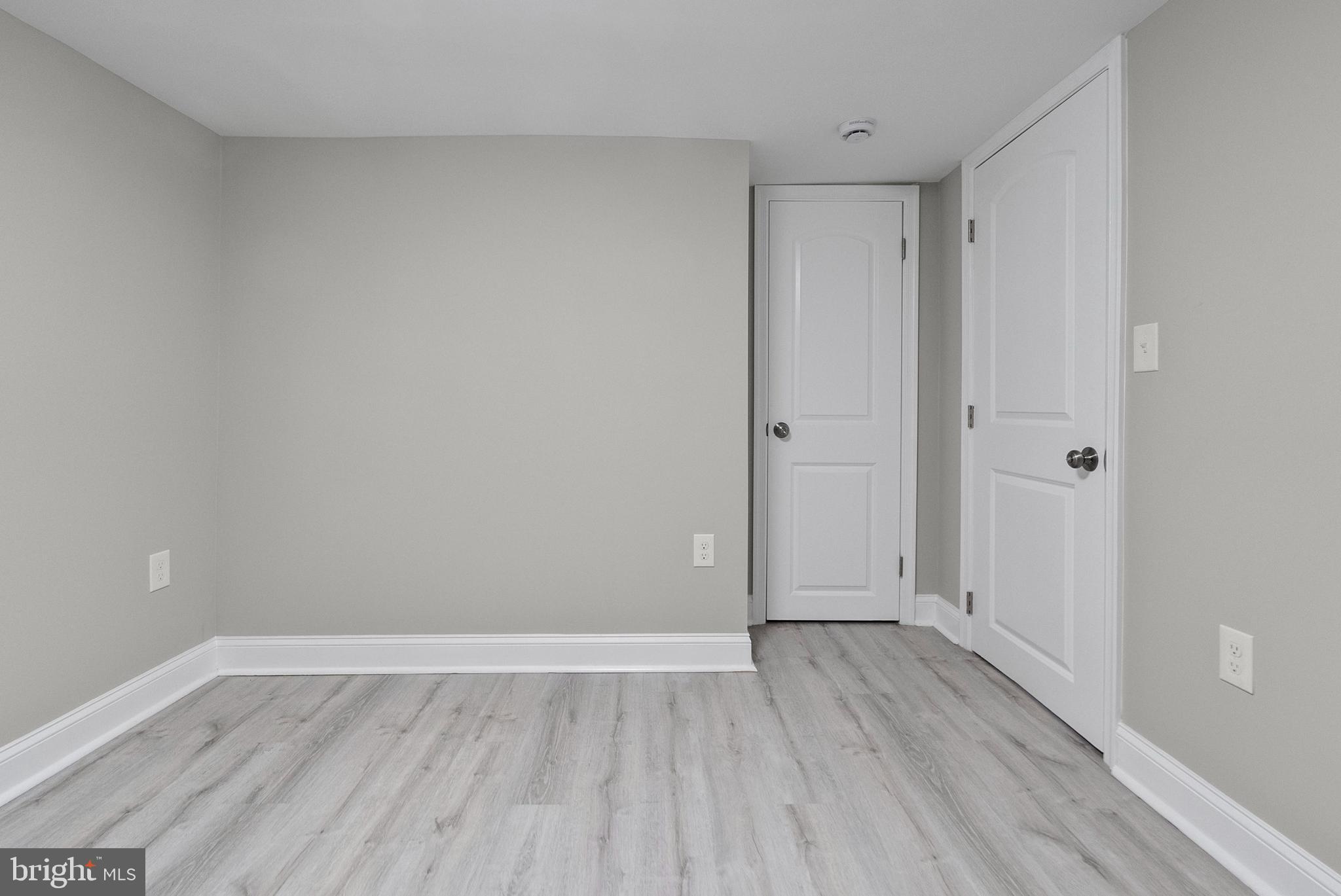1641 Northwick Road Baltimore, MD 21218 - Photo 18 of 24 a view of an empty room with wooden floor
