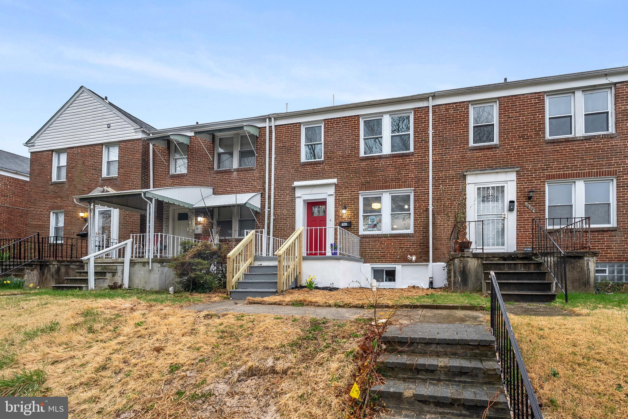 1641 Northwick Road Baltimore, MD 21218 - Photo 23 of 24 a front view of a house with a yard