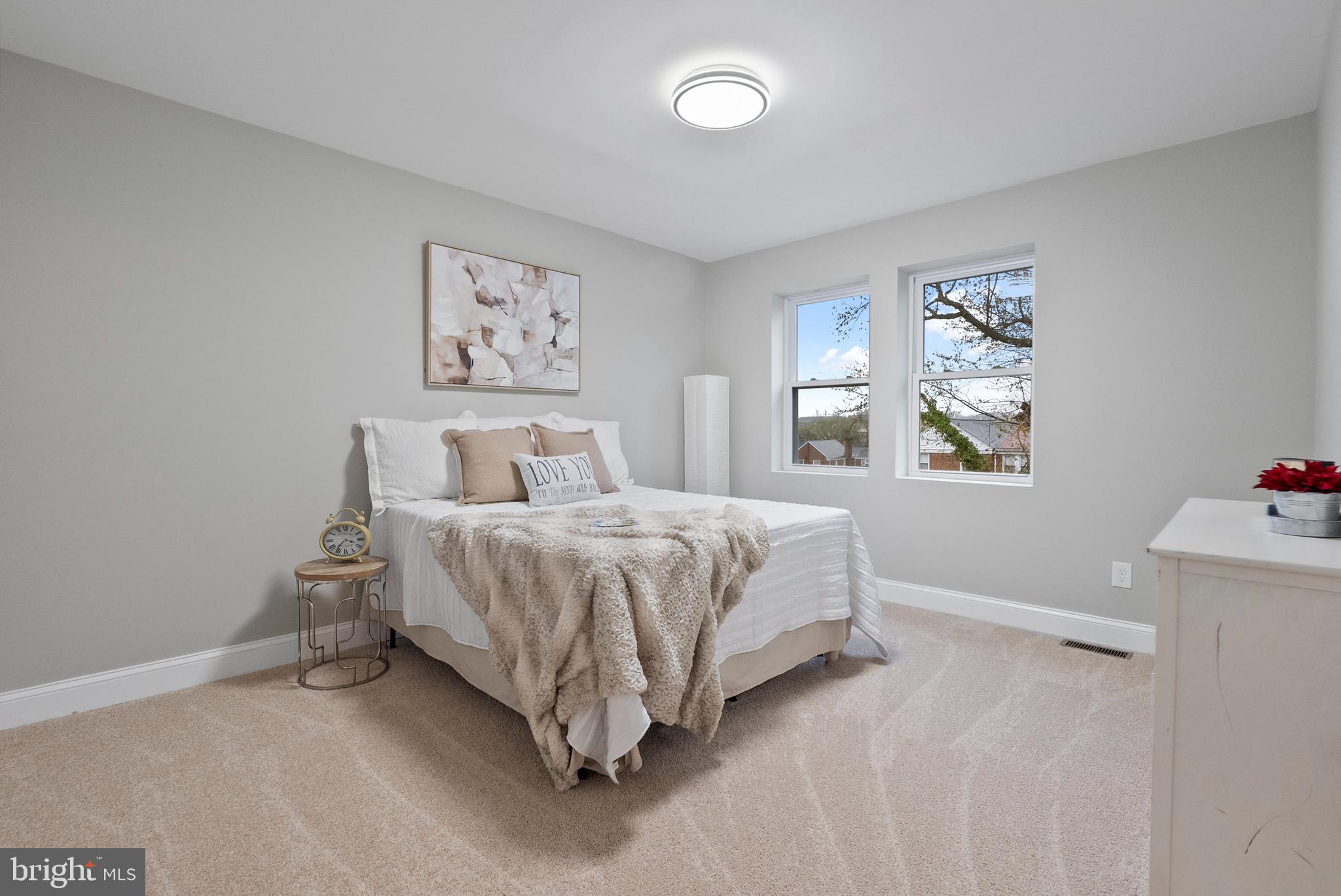 1641 Northwick Road Baltimore, MD 21218 - Photo 8 of 24 a bedroom with a bed and a window