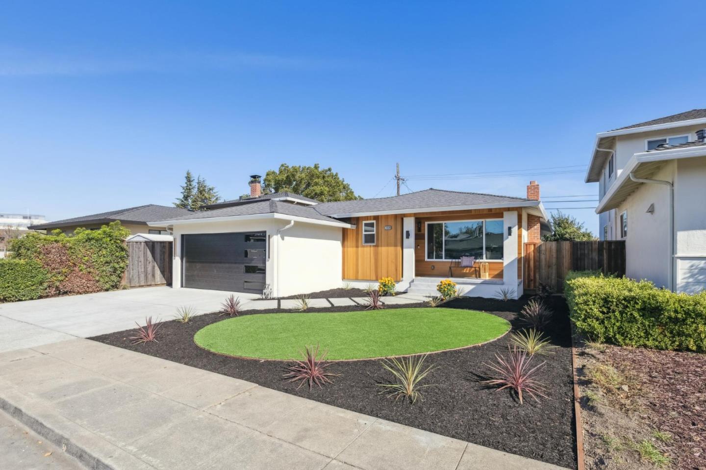 2009 Trinity Street San Mateo, CA 94403 - Photo 1 of 1 a front view of a house with a yard and outdoor seating