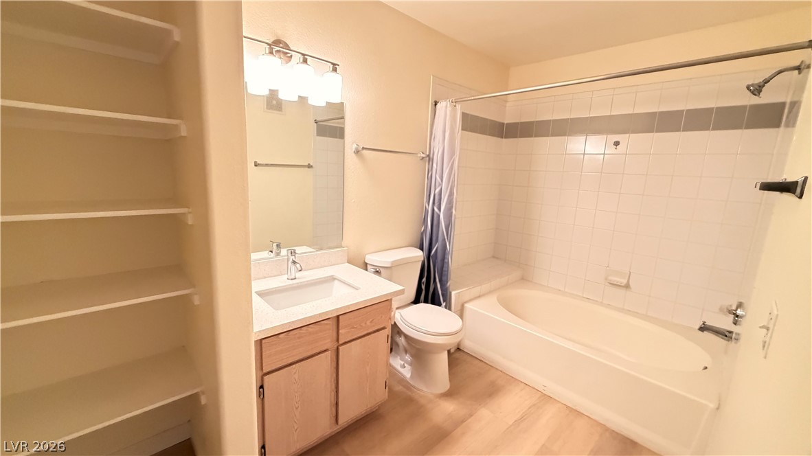 7885 West Flamingo Road, Unit 1131 Las Vegas, NV 89147 - Photo 28 of 36 A well-appointed bathroom featuring ample built-in storage and a pristine tub-shower combination.